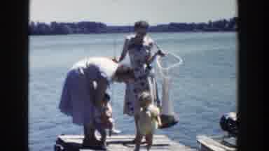 Wisconsin (1953): Mothers With Babies On A Bridge Showing Them The Sea Smiling And