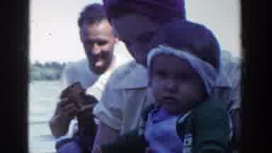 Wisconsin (1953): Man With Two Women And Two Children Sat On A Raft On A River