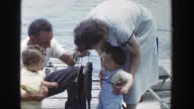 Wisconsin (1953): A Couple Showing Two Freshly Caught Fish To Two Young Children