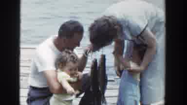 Wisconsin (1953): Father Shows The Fresh Fishes To His Twins