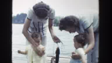 Wisconsin (1953): Two Children Stand With Their Mothers On A Wooden Plank Over A
