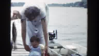 Wisconsin (1953): Mom And Dad Teaching Their Babies To Fish From A Boat On A Lake