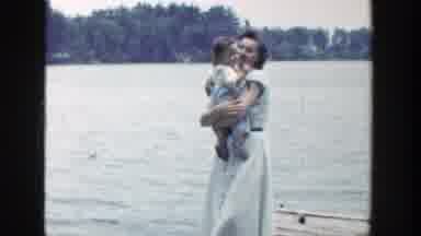 Wisconsin (1953): A Happy Mother Carrying A Cute Little Boy Walking In A Wharf