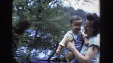Wisconsin (1953): Baby And Mom Smiling In The Field For A Walk Together Knowing