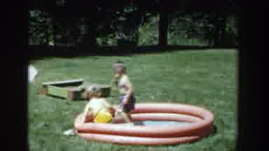 Wisconsin (1953): Boy And Girl Playing In A Kiddie Pool In A Park