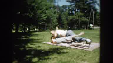 Wisconsin (1953): Man Hugging Women In A Picnic