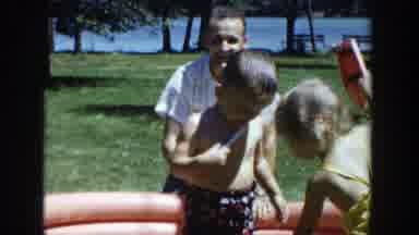 Wisconsin (1953): A Boy And A Girl Taking A Bath In A Small Colored Inflatable