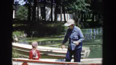Wisconsin (1953): Man On A Little Boat With A Small Child Followed By A Scene Of A