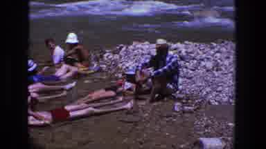 Utah (1969): Group Of People Lying In Riverbed Water On A Bright Sunny Day