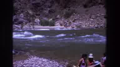Utah (1969): Small Group Of People Sitting Near Rushing River On A Sunny Day