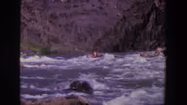 Utah (1969): A Number Of People White Water Rafting On A Very Choppy River With