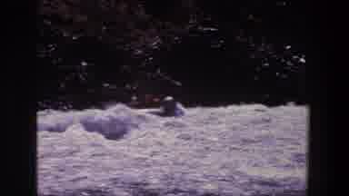 Utah (1969): Large Group Of People Sitting In Grey Inflatable Boat On A Sunny Day