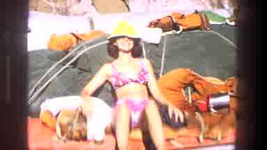 Utah (1969): Middle Aged Women Sitting On Beach And Smiling As Camera Pan To Male