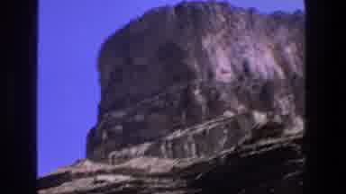 Utah (1969): Upwards Shot Of A Big Mountain Followed By A Downward Facing Angle Of