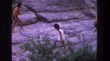 Utah (1969): Young Woman In White Top And Blue Shorts Walking On Large Rock