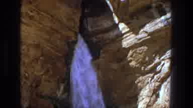 Utah (1969): Water Flowing Out From Hole In Rock Formation Camera Pans Down The