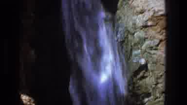Utah (1969): People Bathing And Having Fun Under A Waterfall On A Sunny Day