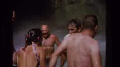 Utah (1969): Group Of People Standing At Bottom Of Waterfall On A Bright Sunny Day
