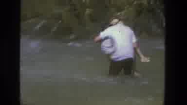 Utah (1969): Man Wearing White Shirt Holds Person Wearing White Shirt While