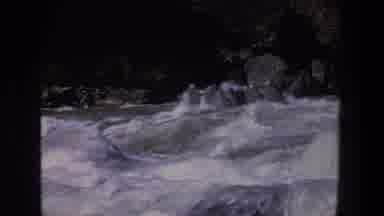 Utah (1969): Large Group In Big Raft White Water Rafting Through Strong Waters