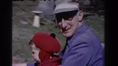 Pequot Lakes Minnesota (1964): Grandfather Riding Child Around Yard