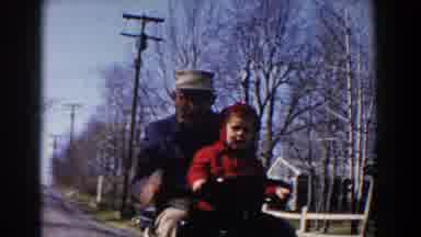 Pequot Lakes Minnesota (1964): A Grandfather And A Young Granddaughter Riding On A