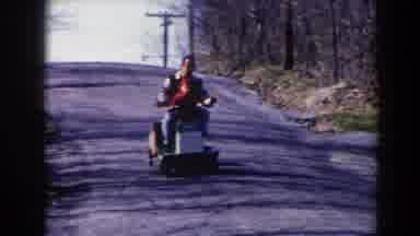 Pequot Lakes Minnesota (1964): Person Wearing White Sweater Helps Toddler Wearing