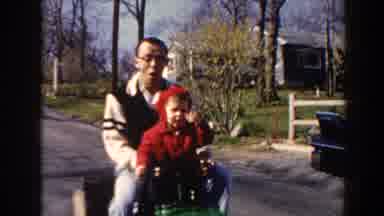 Pequot Lakes Minnesota (1964): Father And Son Riding Children Mini Car On The