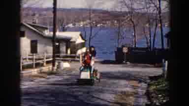 Pequot Lakes Minnesota (1964): Riding Family Small Vehicle Upwards Road From Lack
