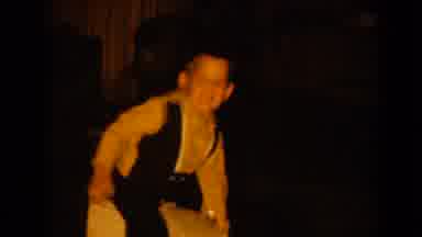 Pequot Lakes Minnesota (1964): Mother Watches As Young Boy Rides On Fathers Back