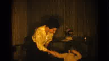 Pequot Lakes Minnesota (1964): Woman Wearing White Shirt Hugs Small Boy Wearing