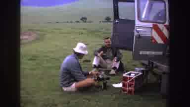 South Africa (1969): Two Men Out The Back Of A Van Having Discussion With