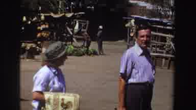 South Africa (1969): Man And Woman Dressed In Blue Striped Shirt And Pants Having