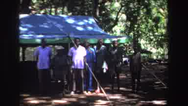 South Africa (1969): Group Of Black Men Standing In Front Of A Blue Tent