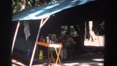 South Africa (1969): View Of Person Sitting Under Green Tent And Outdoor Market