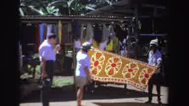 South Africa (1969): People Choose A Tablecloth At The Bazaar