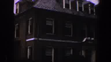 Baltimore Maryland (1960): The Front View Of A Dark Colored Home Surrounded By
