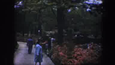 Baltimore Maryland (1960): People Walking Along A Path In A Park Surrounded By