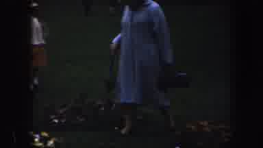 Baltimore Maryland (1960): Woman Walking In The Field Holding An Umbrella And A