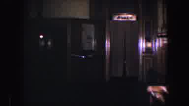 Baltimore Maryland (1960): Woman Wearing Blue Skirt Runs To Elevator Carrying