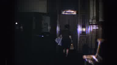 Baltimore Maryland (1960): Woman Walking Through Her House And Moving Beyond