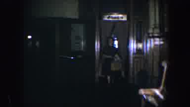 Baltimore Maryland (1960): A Woman Walking Into A Room After Come From Work