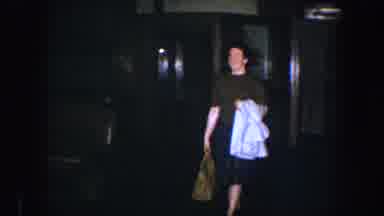 Baltimore Maryland (1960): Woman Leaving A Place Smiling With A Bag And White