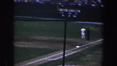 Baltimore Maryland (1960): Kid In Pajamas Proudly Holds Up Hockey Stick In Front