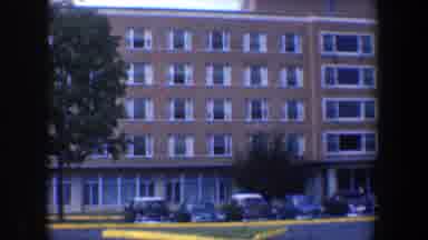 Baltimore Maryland (1960): An Old Building With Full Parking Spaces Seems Very