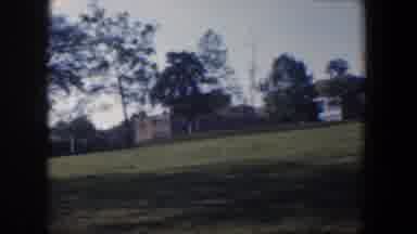 Baltimore Maryland (1960): View Of Tan Buildings Green Grass And Trees On A Clear