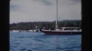 Nassau Bahamas (1961): A Boat In The Blue Sea Near The Coast That Has A Lot Of