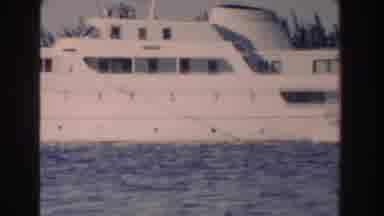 Nassau Bahamas (1961): A Ship Cruising Along In Calm Waters On A Sunny Day Along