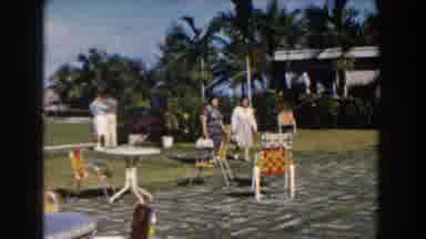 Nassau Bahamas (1961): Two Women Walking Through Grey Stone Courtyard On A Bright