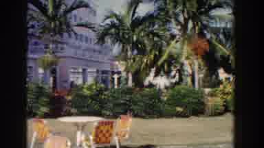 Nassau Bahamas (1961): People In A Tropical Beach With Trees Hotels Sunshine Sky